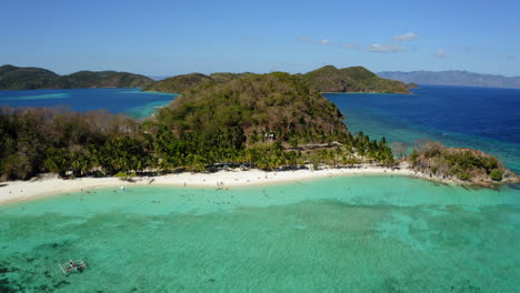 Aerial-view-of-Malcapuya-Beach-island-in-a-sunny-day,-Coron,-Palawan,-Philippines