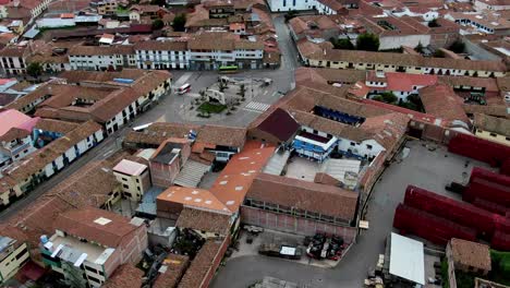 Daytime-4k-Aerial-footage-over-Plaza-Limacpampa-in-Cusco-City,-Peru-during-Coronavirus-lockdown,-tilt-up-and-wide-angle-shot