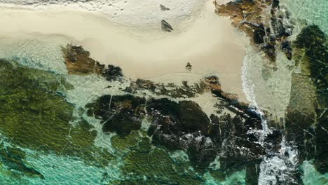 Perfect-white-sandy-beach-from-above-with-gentle-waves,-tropical-island,-aerial