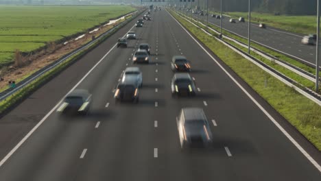 Busy-motorway-commuter-traffic,-time-lapse-of-cars-driving-in-lanes