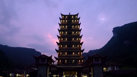 Landmark-pagoda-at-the-Wulingyuan-exit-and-entrance-to-the-Zhangjiajie-national-park-in-the-evening,-Hunan-Province