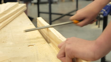 Student-Using-A-Rasping-Tool-In-Woodwork-Classroom,-CLOSE-UP