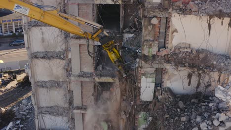 View-of-an-Excavator-demolishing-apartmentbuilding