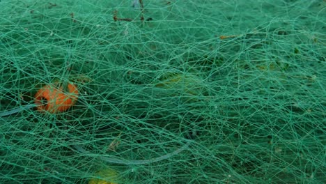 fishing-industry,-contamination-of-the-ocean,-fishing-net-on-the-beach