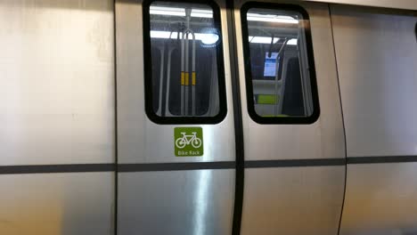 BART-metro-train-doors-closing-for-departure-from-San-Francisco-underground-tunnel-new-compartments