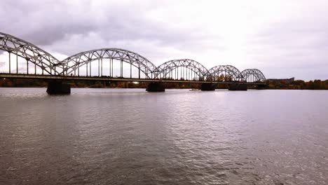 Empty-iron-railway-bridge-in-Riga,-Latvia-in-cloudy-autumn-day