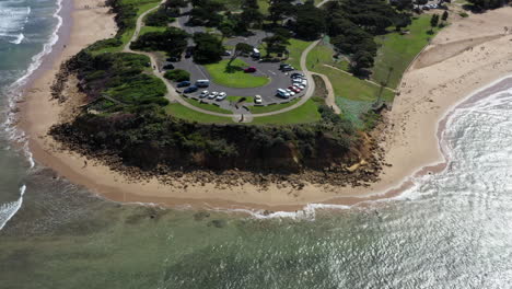AERIAL-DOLLY-BACK-Over-Point-Danger,-Torquay-Australia-On-A-Summer-Day