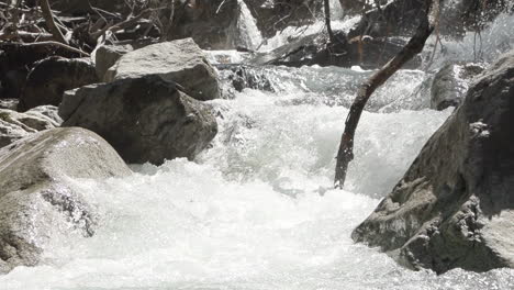 Slowmotion-Detail-shot-of-how-the-water-moves-between-the-rocks