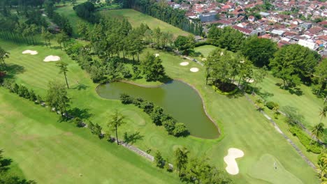 Grand-tropical-golf-course-in-Magelang,-Indonesia,-sport-venue-aerial-view