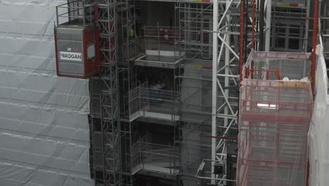 Moving-Construction-Site-Elevators-In-Millbank,-London