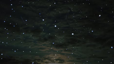 Stars-floating-and-twinkling-on-dark-cloudscape-background