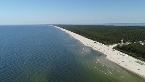 Aerial-view-of-beach-entrance,-full-of-people