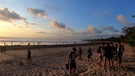 Catching-the-sunset-along-a-beach-in-Bali,-Indonesia-during-golden-hour