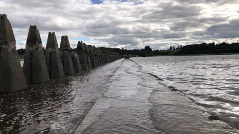 Tide-returning-to-Crammond-Island-and-covering-the-path-with-water,-Edinburgh,-Scotland