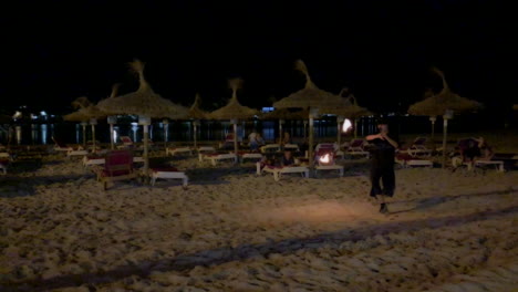 Juggle-with-fire-on-the-beach-at-night