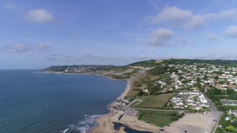 Aerial-tracking-forward-towards-the-quaint-village-of-Charmouth-in-the-heart-of-the-Dorset-countryside