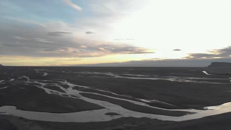 Aerial-Panning-Shot-of-Glacial-Rivers-at-Sunrise