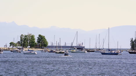 a-summer-day-at-Nanaimo-harbor-front-with-boats-taking-a-ride-on-the-west-coast,-Vancouver-Island,-British-Columbia