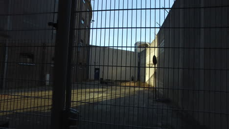 Prison's-basketball-field-behind-metal-mesh