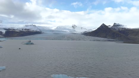 Aerial-Establishing-Shot-of-a-Glacier-and-Lagoon