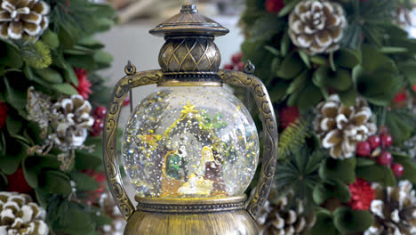 Beautiful-snowglobe-with-child-in-the-manger-on-Christmas-background