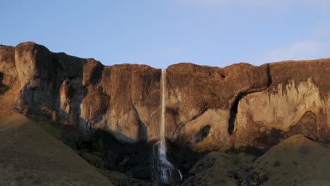 Wide-Shot-of-a-Stunning-Waterfall-at-Sunset