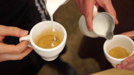 SLOWMO---Barista-Draws-Milk-Over-Espresso-Coffee---Making-Latte-Art-Pattern-For-Cappuccino---Close-Up