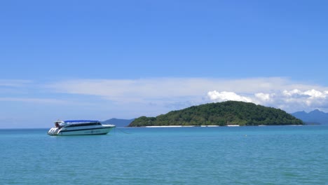 A-high-end-speedboat-near-a-small-beautiful-deserted-island