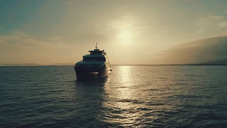 Drone-footage-during-sunrise-from-an-elegant-boat-near-the-coast