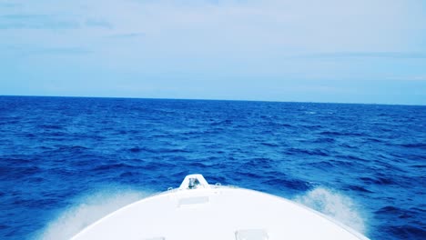 White-yacht-splashing-through-choppy-ocean,-Slow-motion-point-of-view-shot