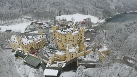 Aerial-View-Of-Hohenschwangau-straight-over-the-castle-in-winter