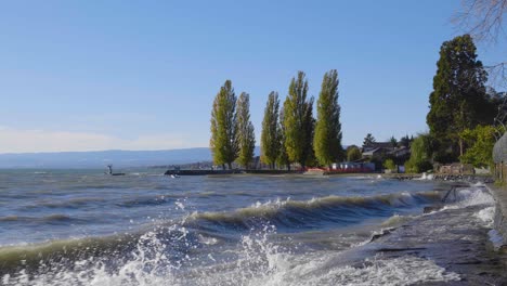 Pathway-along-the-shore-of-Lake-Léman-splashed-by-the-waves-on-a-windy-day