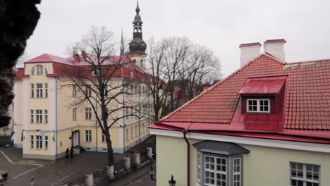 tracking-and-panning-right-shot-of-Tallinn-old-town-through-the-medieval-fortification-stone-wall