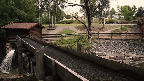 Water-going-through-old-wooden-river-mill-in-slow-motion