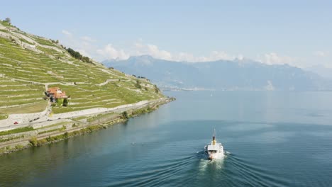 Aerial-shot-following-CGN-Belle-Epoque-steam-boat-on-Lake-Léman-in-front-of-Lavaux-vineyard