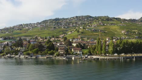 Aerial-orbit-over-Lake-Léman-in-front-of-Cully,-Lavaux---Switzerland