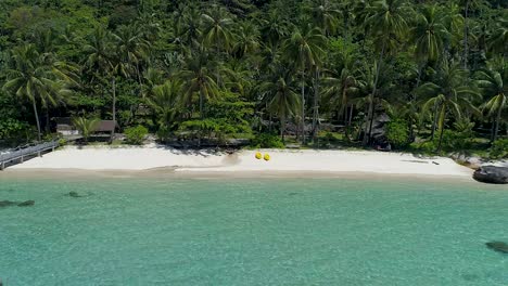 Revealing-aerial-shot-of-a-perfect-tropical-private-beach-in-Asia