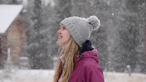 a-medium-shot-of-a-young-caucasian-lady-enjoying-snow-in-slow-motion