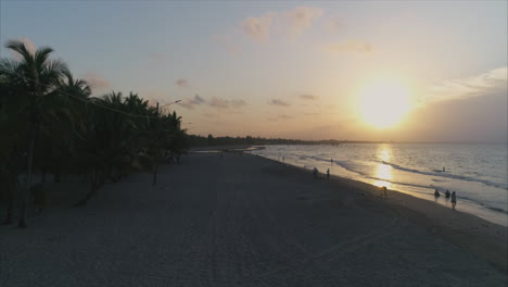 AERIAL:-Slow-motion-sunset-on-Honduran-beach---Tela,-Honduras-1