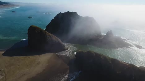 AERIAL:-View-from-far-above-some-very-large-rock-formations-sitting-on-Oregon's-coastline