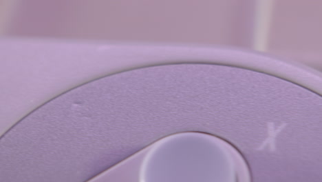 Logo-on-Vintage-Super-Nintendo-Controller-in-Purple-Light-SLIDE-RIGHT