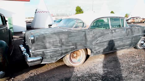 Old-rusted-black-1950s-sedan