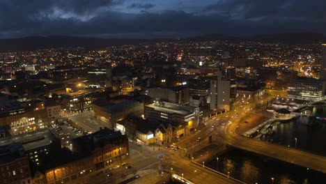 Aerial-flyover-of-Belfast-City-Centre-and-Lagan-River-at-night
