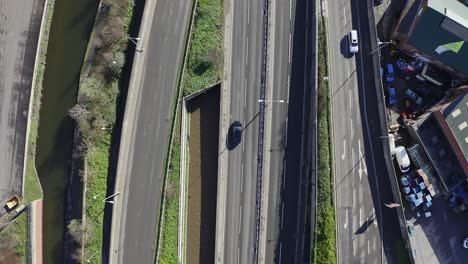 Aerial-footage-of-the-A50,-A500-motorway,-dual-carriage-way-in-the-heart-of-the-city-of-Stoke-on-Trent-in-Staffordshire,-Commuters-travel-north-and-south-on-the-roads