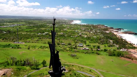 Very-tall-statue-of-Christopher-Columbus-erected-along-the-coast-in-Arecibo,-Puerto-Rico