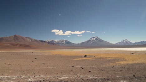 Salt-lagoon-near-volcanoes-in-the-middle-of-the-Atacama-Desert,-Chile,-South-America