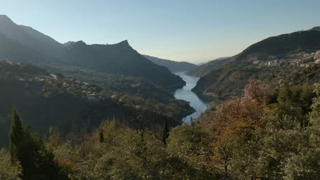 Tilt-View-Over-Hills-and-Lake-near-Güéjar-Sierra,-Spain