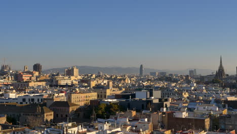 Panning-shot-of-the-Barcelona-skyline-on-a-sunny-winter-morning