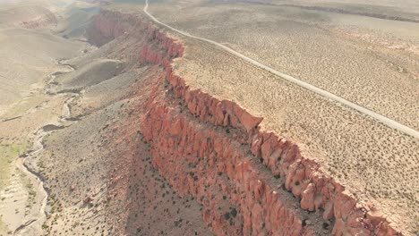 Beautiful-remote-dirt-road-in-the-Atacama-Desert-near-a-cliff