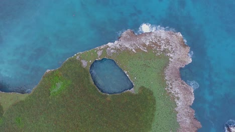 Aerial-cenital-shot-of-a-big-hole-in-the-Isla-Redonda,-Marietas-Islands,-Nayarit,-Mexico